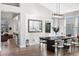Inviting dining area with modern lighting, stylish decor, and easy access to kitchen and living spaces, ideal for gatherings at 1053 Snow Lily Ct, Castle Pines, CO 80108