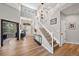 Grand two-story foyer with staircase and ample natural light at 1053 Snow Lily Ct, Castle Pines, CO 80108