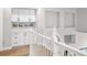 Hallway landing features built-in cabinets and decorative alcoves at 1053 Snow Lily Ct, Castle Pines, CO 80108