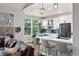 Open-concept kitchen and breakfast nook with modern appliances, a breakfast bar, and seamless access to the living area at 1053 Snow Lily Ct, Castle Pines, CO 80108