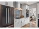 Modern kitchen with stainless steel appliances, sleek cabinetry, and a view into the dining area, perfect for cooking and entertaining at 1053 Snow Lily Ct, Castle Pines, CO 80108
