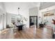 Open-concept living space featuring a dining area, entryway, and lots of natural light at 1053 Snow Lily Ct, Castle Pines, CO 80108