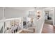 Open and airy loft space with natural light and railing overlooking main floor at 1053 Snow Lily Ct, Castle Pines, CO 80108