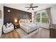 Comfortable main bedroom with large windows and a king-size bed with luxurious pillows at 1053 Snow Lily Ct, Castle Pines, CO 80108