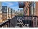 Balcony showing the exterior of nearby buildings, as well as a black metal fire escape at 2960 Inca St # 308, Denver, CO 80202