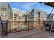 Balcony view of the courtyard featuring a swimming pool and several modern buildings at 2960 Inca St # 308, Denver, CO 80202