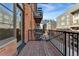 A balcony with a view of the exterior buildings, and a brick fire escape on the side at 2960 Inca St # 308, Denver, CO 80202
