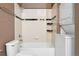 Cozy bathroom includes a tub, shower, toilet, and laundry area at 2960 Inca St # 308, Denver, CO 80202