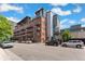 Building exterior featuring apartments with balconies and street parking at 2960 Inca St # 308, Denver, CO 80202