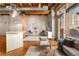 Open living space boasts exposed beams, hardwood floors, and natural light at 2960 Inca St # 308, Denver, CO 80202