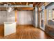 Expansive living space featuring hardwood floors, exposed ceiling, and beams with ample natural light at 2960 Inca St # 308, Denver, CO 80202