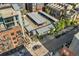 Aerial view of the parking area with covered parking and the exterior of surrounding buildings at 2960 Inca St # 308, Denver, CO 80202
