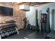 Functional workout space featuring a weight rack, fitness equipment and a mounted TV for entertainment at 2960 Inca St # 308, Denver, CO 80202
