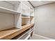 Walk-in closet with built in shelves and wood countertop at 7765 S Curtice Dr # A, Littleton, CO 80120