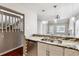Breakfast bar with granite countertops, undermount sink, stainless dishwasher and hardwood floors at 7765 S Curtice Dr # A, Littleton, CO 80120