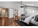 Spacious main bedroom boasts vaulted ceiling, skylight, hardwood floors, and ensuite bathroom at 7765 S Curtice Dr # A, Littleton, CO 80120