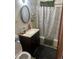 Cozy bathroom with an oval mirror and a shower/tub combination, ready for your personal touch at 1132 Moline St, Aurora, CO 80010