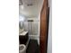 Bathroom features a vanity sink and a shower-tub with a stylish shower curtain at 1132 Moline St, Aurora, CO 80010