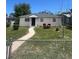 Charming single-story home featuring a well-maintained lawn and quaint front porch at 1132 Moline St, Aurora, CO 80010