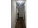 Hallway with built-in cabinets, offering ample storage and access to various rooms in the home at 1132 Moline St, Aurora, CO 80010