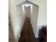 Hallway with clean lines, neutral walls, and coordinating carpet at 1132 Moline St, Aurora, CO 80010