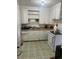 Cozy kitchen featuring classic cabinetry, a functional layout, and essential appliances for everyday cooking at 1132 Moline St, Aurora, CO 80010