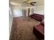 Inviting living room featuring a comfortable seating arrangement and a ceiling fan at 1132 Moline St, Aurora, CO 80010
