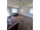 A cozy living room features ample space and large windows for natural light at 1132 Moline St, Aurora, CO 80010