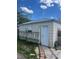 Exterior of the detached garage with a white door, offering additional storage space at 1132 Moline St, Aurora, CO 80010