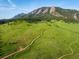 Scenic aerial view of Boulder Mountain with hiking trails and vibrant green landscape at 850 20Th St # 203, Boulder, CO 80302