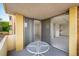Balcony with a table and chairs, with an entryway into a bedroom and a view of the street at 850 20Th St # 203, Boulder, CO 80302