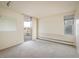Bedroom features neutral carpet, a sliding glass door to a balcony, and a window at 850 20Th St # 203, Boulder, CO 80302