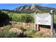 Colorado Chautauqua National Historic Landmark sign, set among lush greenery and Boulder Mountain backdrop at 850 20Th St # 203, Boulder, CO 80302