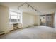 Bright, spacious living area with large windows and sliding glass doors to a balcony, perfect for relaxing at 850 20Th St # 203, Boulder, CO 80302