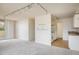 Inviting living space with a view of the kitchen and sliding glass doors for access to a balcony at 850 20Th St # 203, Boulder, CO 80302