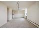 Large living room with open space, including track lighting, closet and an adjacent kitchen at 850 20Th St # 203, Boulder, CO 80302