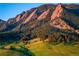 Striking view of Boulder Mountain's rock formations and lush green forests under a clear sky at 850 20Th St # 203, Boulder, CO 80302