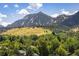 Mountain view from the property, overlooking trees, a field, and houses at 850 20Th St # 203, Boulder, CO 80302