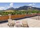 Rooftop deck featuring seating, a brick wall, and a mountain view at 850 20Th St # 203, Boulder, CO 80302