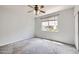Bedroom with neutral carpeting, large window and ceiling fan at 5537 Lewis Ct # 4, Arvada, CO 80002
