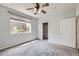 Bedroom with closet, window view, neutral carpeting and ceiling fan at 5537 Lewis Ct # 4, Arvada, CO 80002