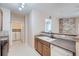 View of kitchen with stainless steel appliances and view into laundry room at 5537 Lewis Ct # 4, Arvada, CO 80002