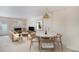 Elegant living room with a fireplace, modern lighting, a dining table with seating, and stylish décor at 1915 S Balsam St, Lakewood, CO 80227