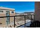 Balcony view overlooking the cityscape, mountains, and walkways at 20 Wilcox St # 312, Castle Rock, CO 80104