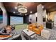 Modern golf simulator room with seating area at 20 Wilcox St # 312, Castle Rock, CO 80104