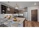 Modern kitchen with breakfast bar and stainless steel appliances at 20 Wilcox St # 312, Castle Rock, CO 80104
