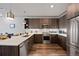 Modern kitchen featuring stainless steel appliances, wooden cabinets, and a sleek countertop at 20 Wilcox St # 312, Castle Rock, CO 80104