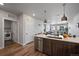 Open concept kitchen with island, stainless steel appliances and laundry at 20 Wilcox St # 312, Castle Rock, CO 80104