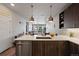 Open concept kitchen with island and modern finishes at 20 Wilcox St # 312, Castle Rock, CO 80104