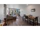 Open-concept living room and dining area with hardwood floors and natural light at 20 Wilcox St # 312, Castle Rock, CO 80104